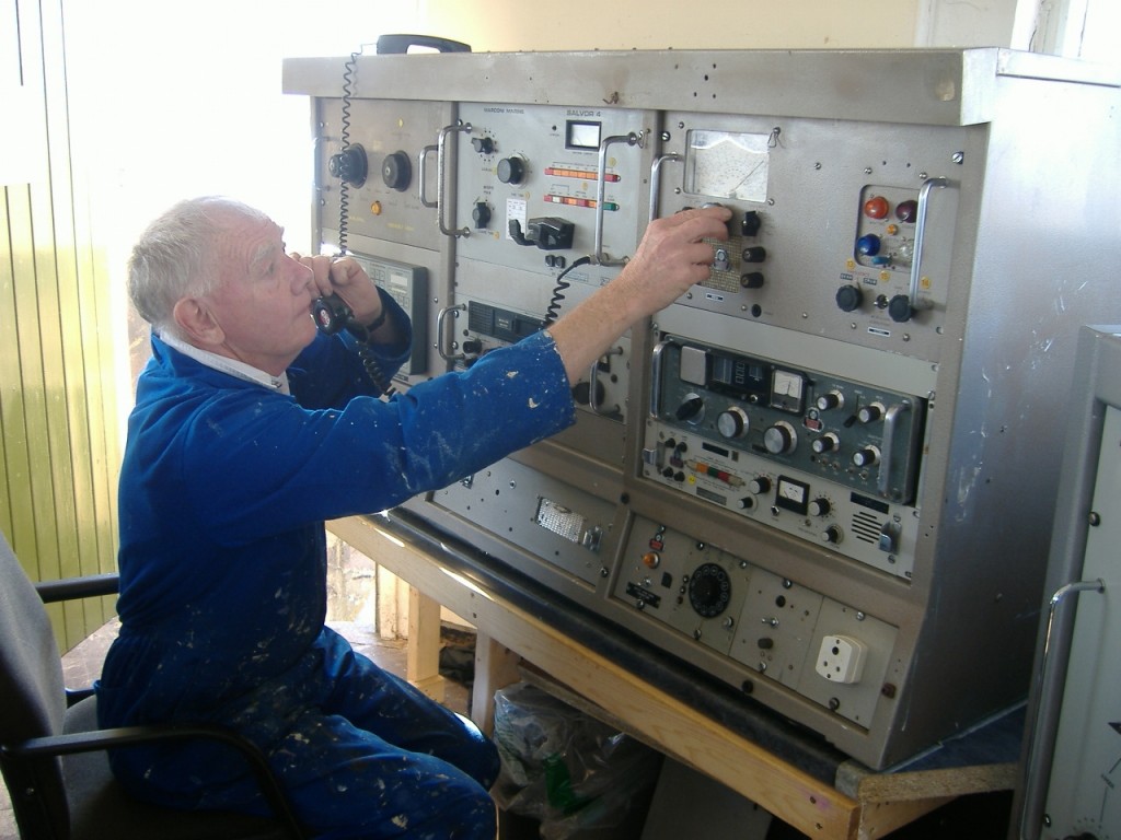 Stan MacNally at the Marconi Main Ships Radio Room Console